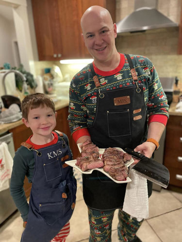 Photo of Dr. Smallidge cooking with son