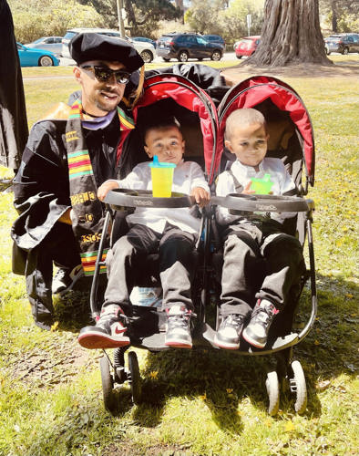 Photo of Dr. Sorrell with his children at dental school graduation