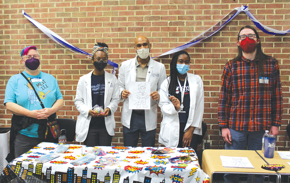 Dental students and other volunteers take a moment during the Feb. 11 GKAS event at Howard.