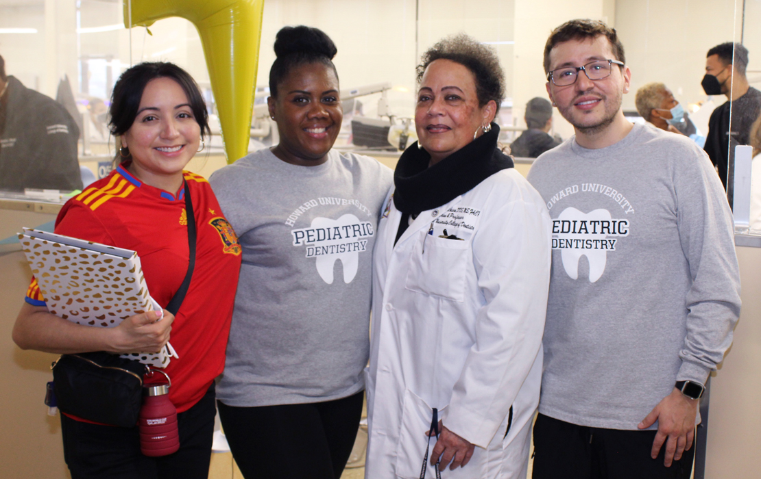 Photo of Claudia Tristán, Migrant Solidarity Mutual Aid Network; LaToya Barham, D.D.S., pediatric dental residency director, Howard University College of Dentistry; Andrea Jackson, D.D.S., dean, Howard University College of Dentistry; and Jose Garcia, pediatric dental resident, Howard.